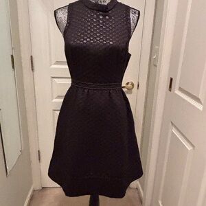 Black polka dot fit and flair cocktail dress
